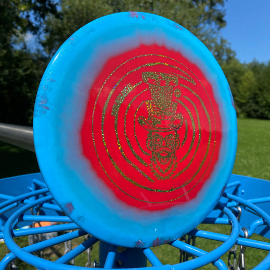 Innova Mako3 Midrange im exklusiven WOD Hutman Design
Detail, blau rote Version, gold glitzernder Stamp